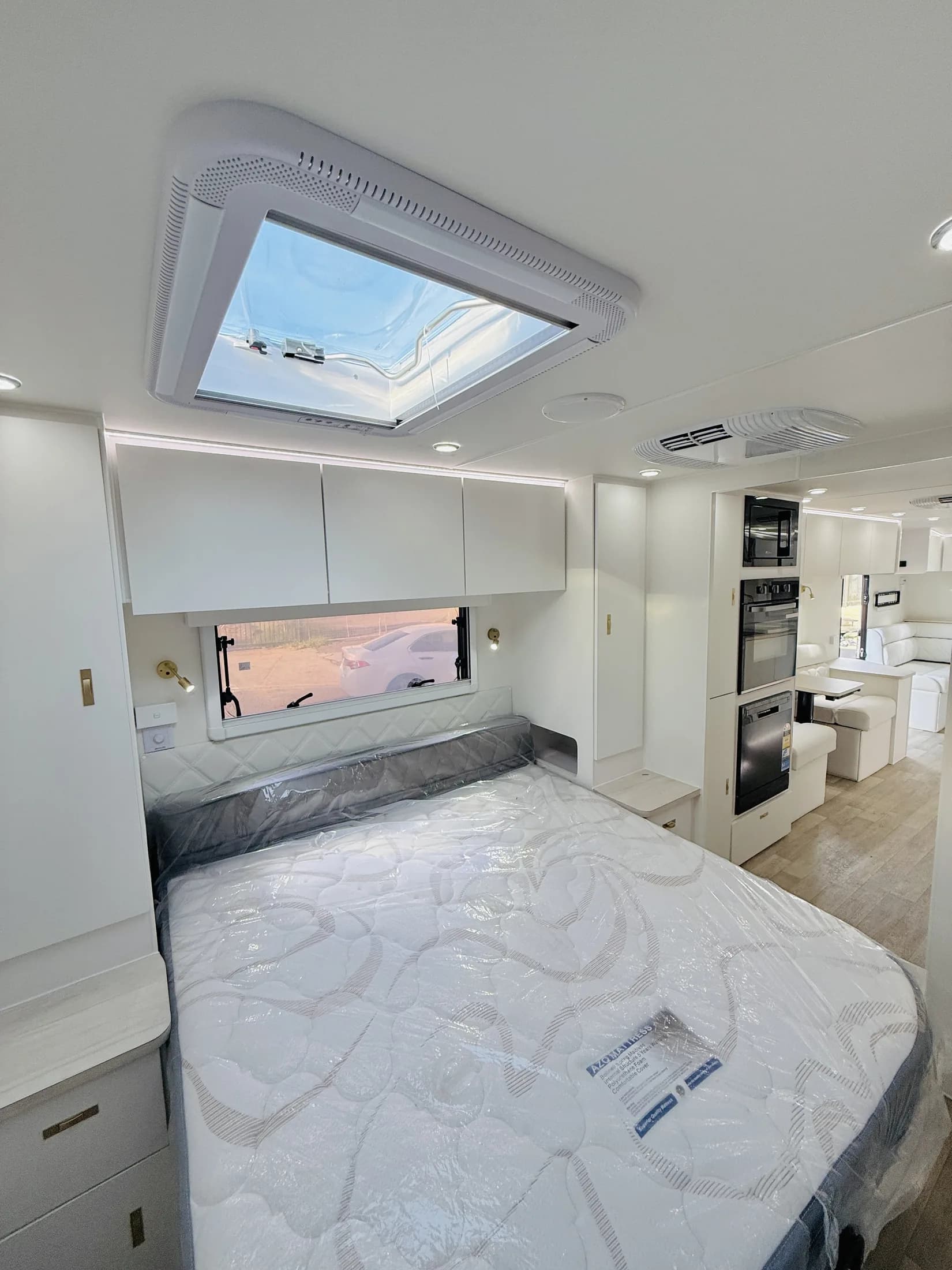 Sunstar master bedroom with island bed, panoramic roof hatch and upholstered bedhead