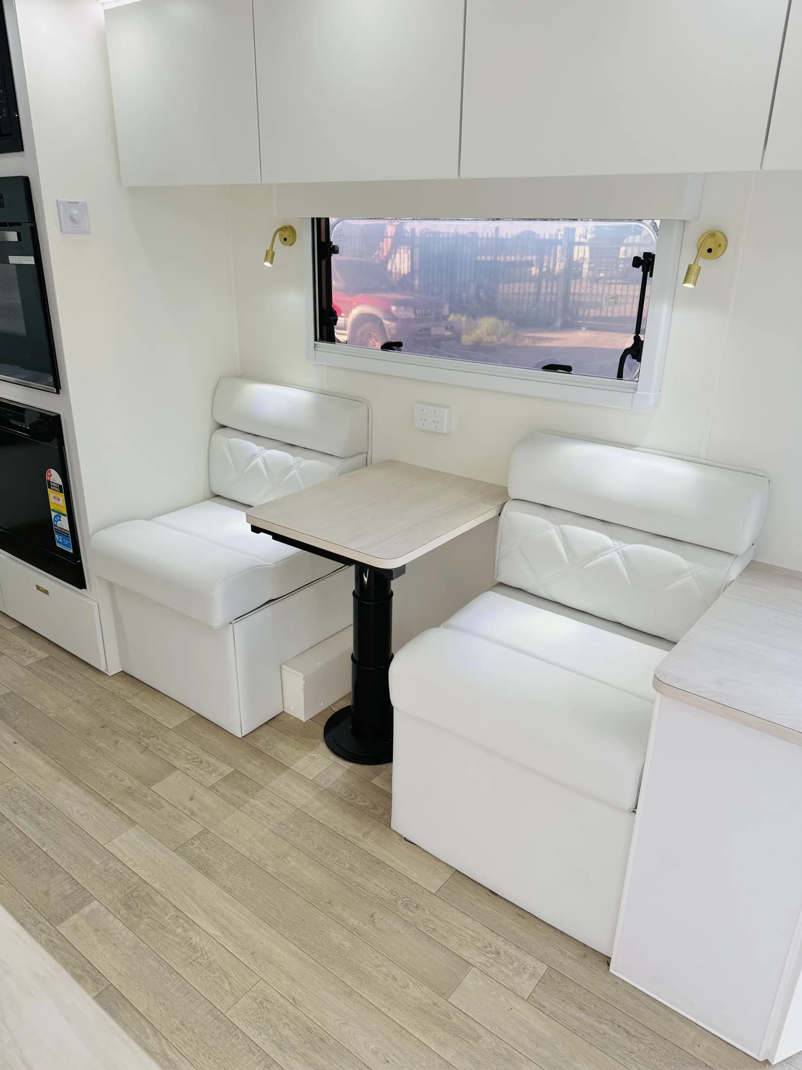White dinette with brass accents